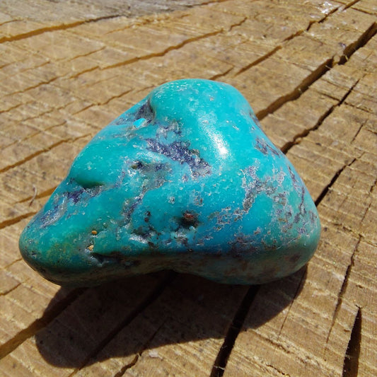 Trommelstein Türkis (China).